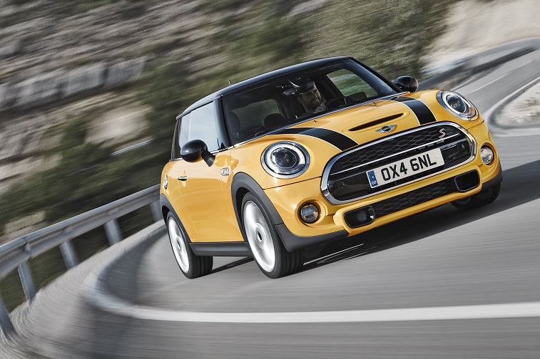 The Mini Cooper S driving on a curvy road.