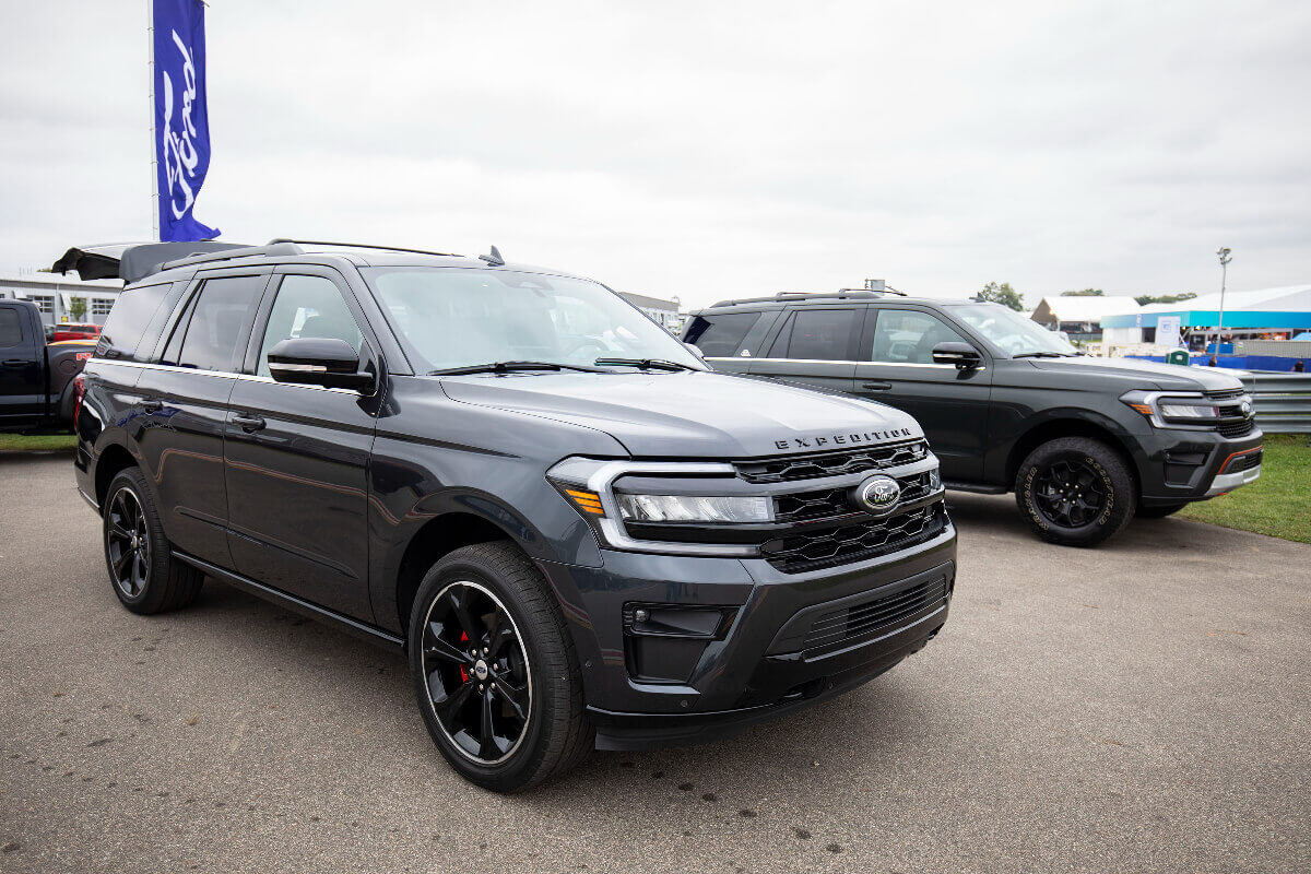 A Ford Expedition SUV is parked.