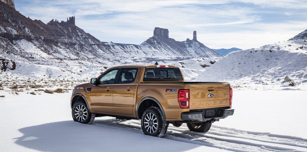 Pale-orange 2019 Ford Ranger parked in a snowy desert