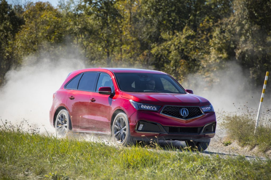 2019 Acura MDX driving down dusty road