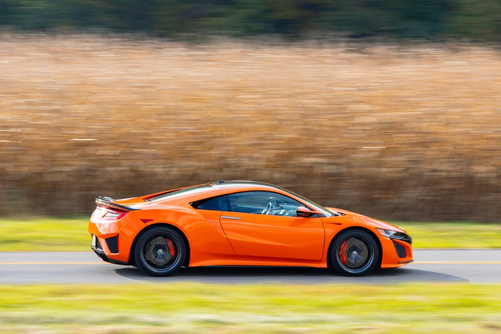 a side shot of a second-generation acura nsx in orange