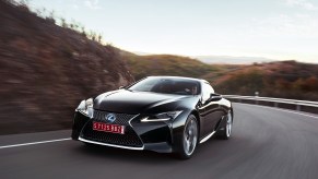 The Lexus LC 500h at speed on a winding scenic road