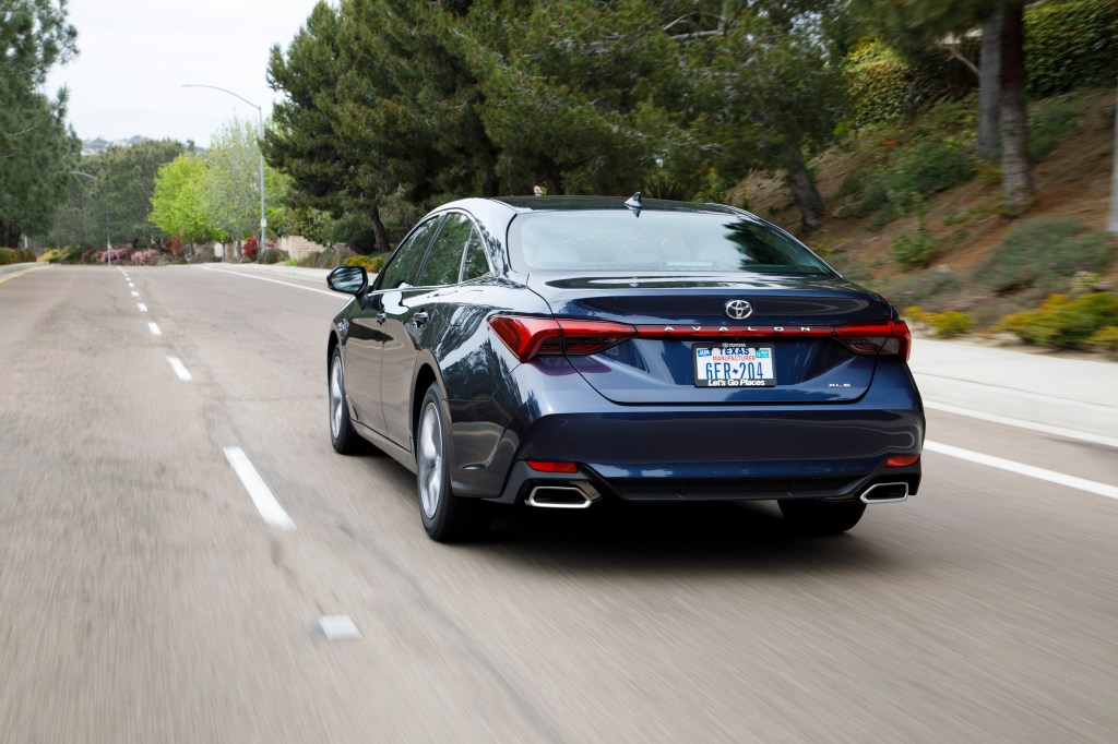 a redesigned Toyota Avalon at speed on the road 
