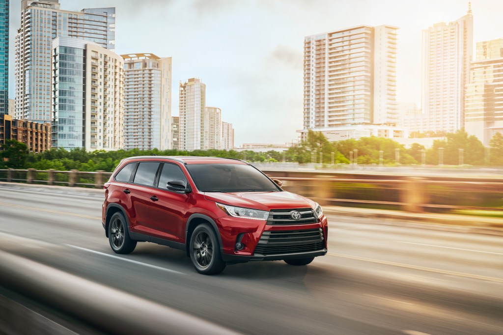 2019 Toyota Highlander driving down the highway