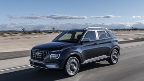 2020 Hyundai Venue driving down road near beach