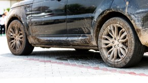 Black SUV with muddy tires