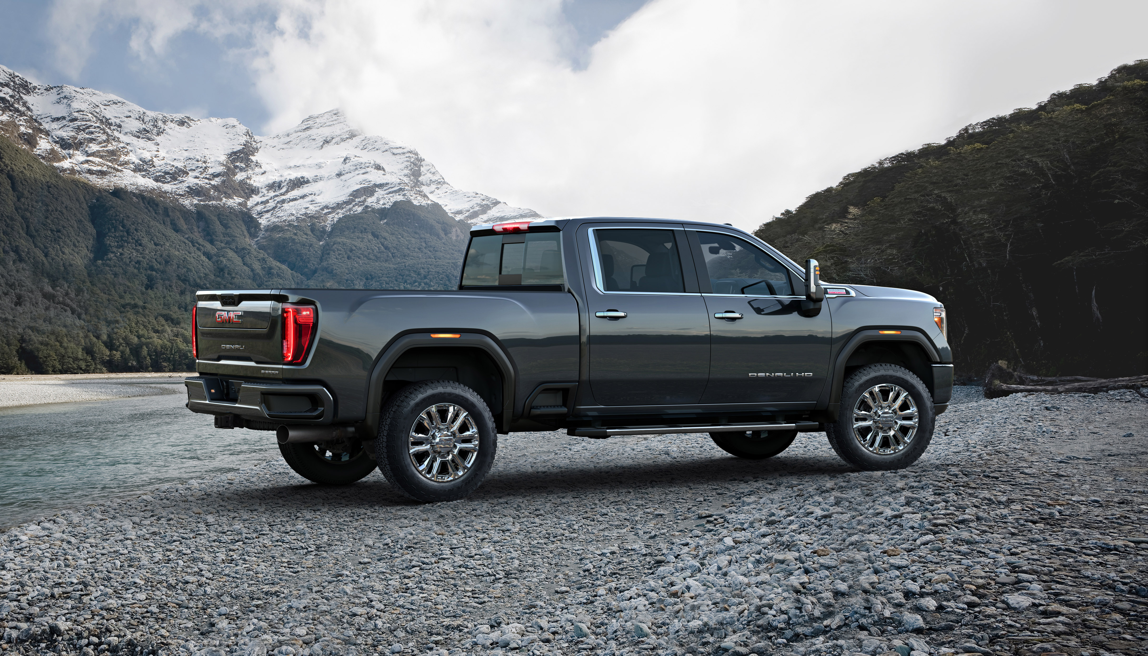 The GMC Sierra 2500HD parked off road in the mountains. 
