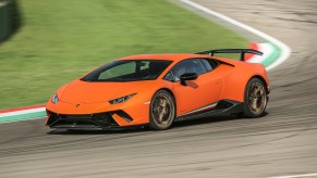 Orange Lamborghini huracan on a track