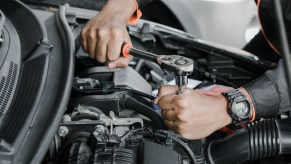 Mechanic-fixing-a-car-at-home-maintenance