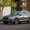 A grey 2017 Audi Q7 parked curbside.