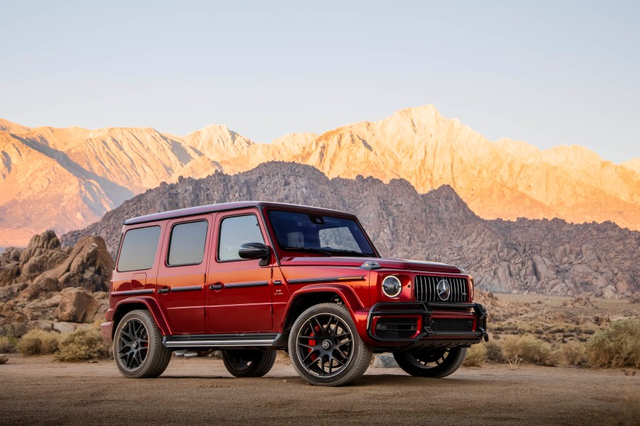 A red 2020 Mercedes-AMG G63 parked by the side of a scenic canyon road.