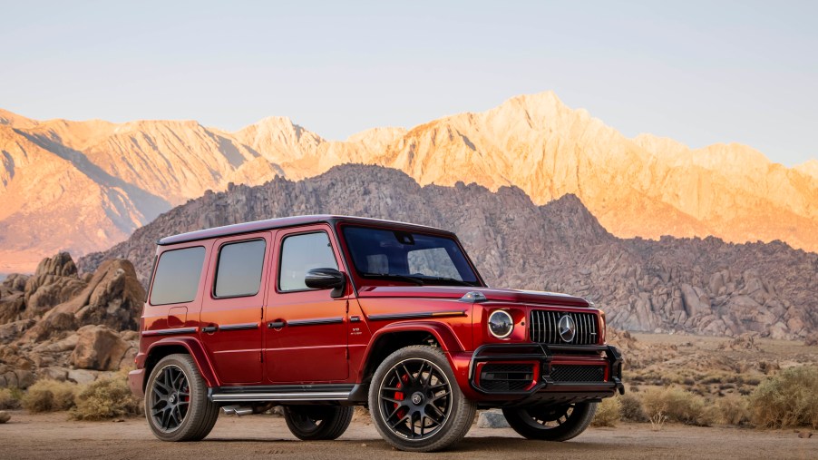 A red 2020 Mercedes-AMG G63 parked by the side of a scenic canyon road.