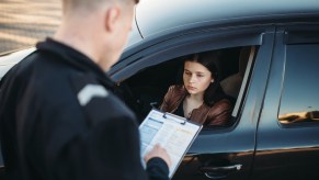 Woman receives a speeding ticket.
