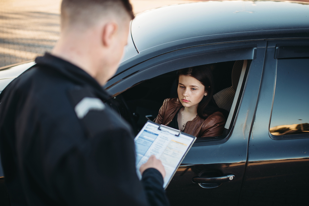 Woman receives a speeding ticket.