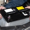 auto-mechanic-replacing-car-battery