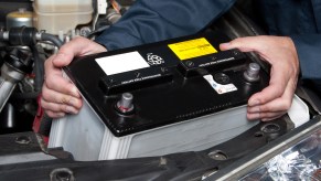 auto-mechanic-replacing-car-battery