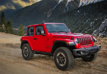 2018 Jeep Wrangler Rubicon driving down dirt road