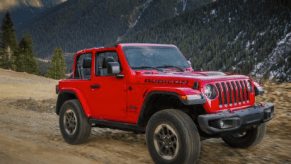 2018 Jeep Wrangler Rubicon driving down dirt road