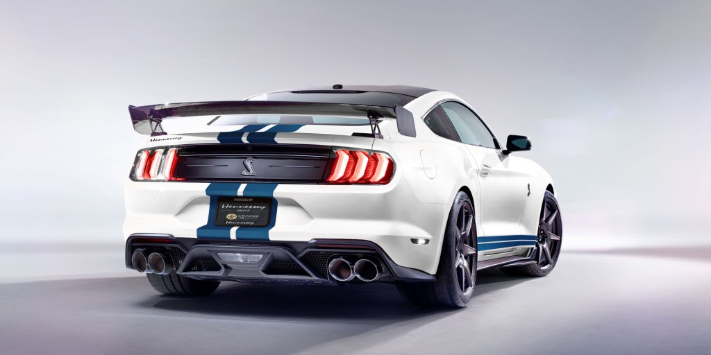 White 2019 Mustang with blue competition stripes