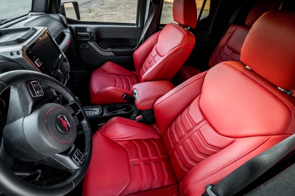 The Rezvani Tank SUV's interior, showing leather dashboard and red leather seats