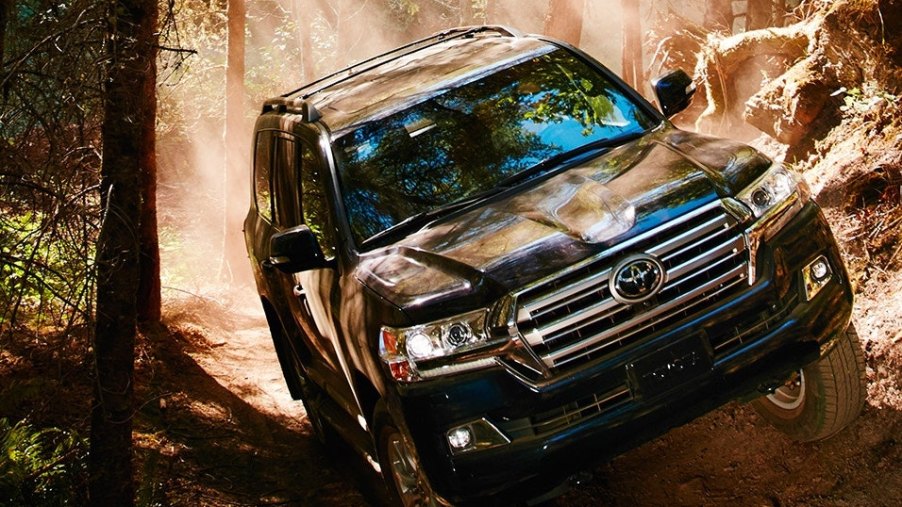 2019 Toyota Land Cruiser off-roading over rocky trail