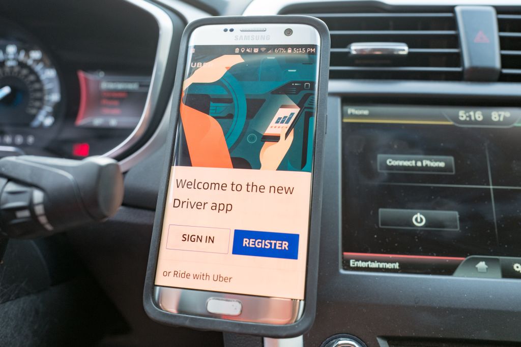 Close up of smartphone with the Uber driver app pulled up