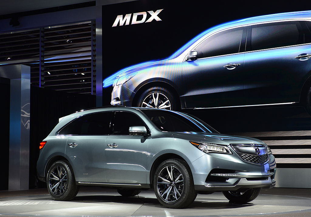 Acura MDX crossover being displayed at a motor show.