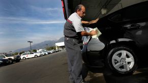 Car being waxed to help maintain its value.