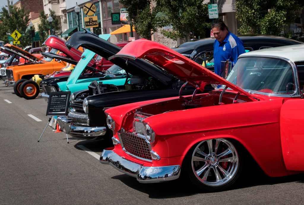 A line-up of classic cars at a car show