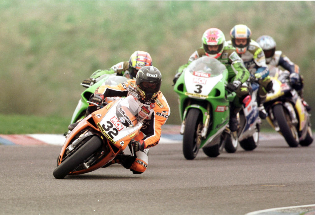 Motorcycle race showing a motorcycle handling a tight turn.