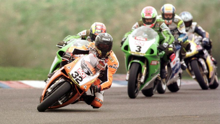 Motorcycle race showing a motorcycle handling a tight turn.