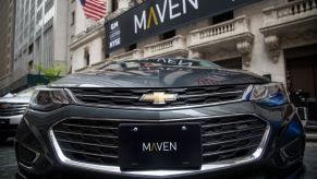A GM Maven car-sharing service vehicle in front of the New York Stock Exchange