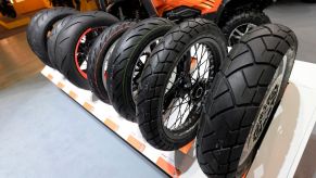 Motorcycle tires are displayed at moto show