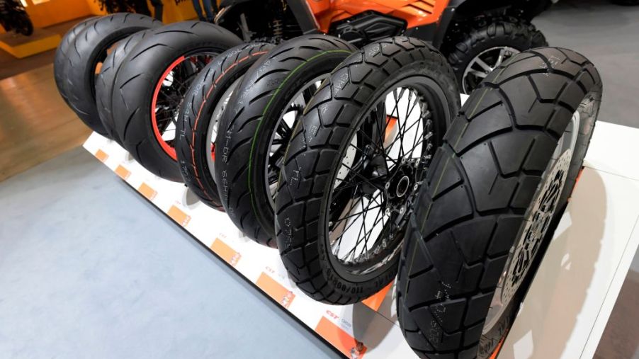 Motorcycle tires are displayed at moto show
