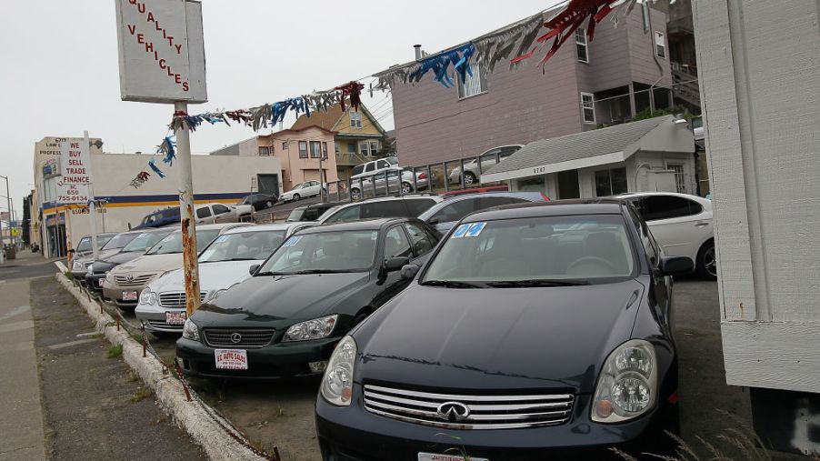 Used cars are displayed on a sales lot