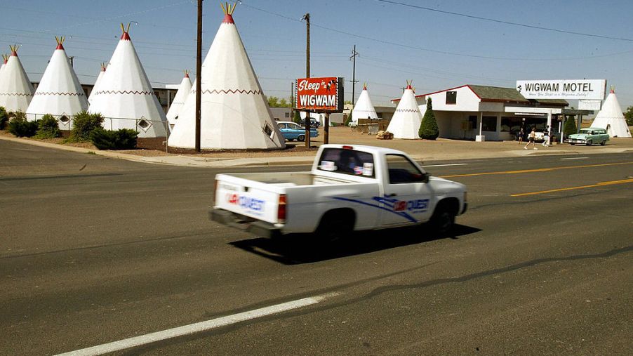 A truck drives by the Wigwam Village on Route 66 in Holbrook, Arizona