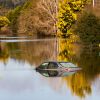 A vehicle submerged in flood waters is likely totaled