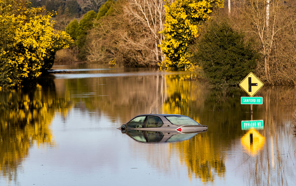 A vehicle submerged in flood waters is likely totaled
