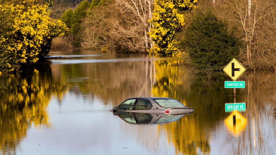A vehicle submerged in flood waters is likely totaled