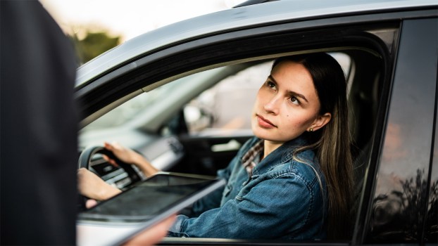 young-woman-talking-to-traffic-police
