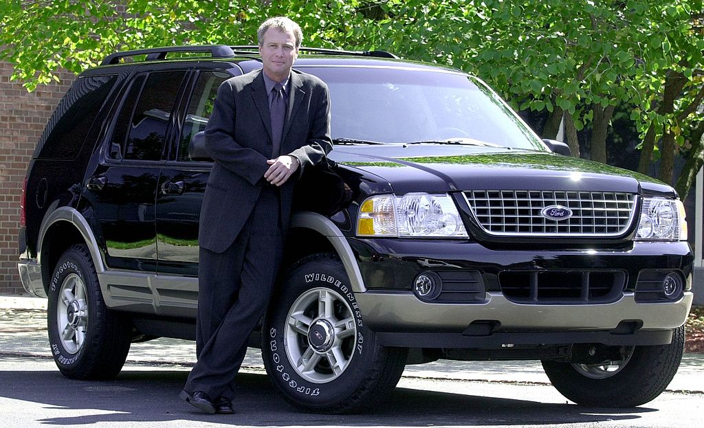 Ford President of Design, J Mays poses next to the new 2002 Ford Explorer
