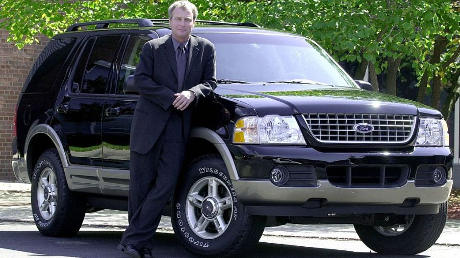 Ford President of Design, J Mays poses next to the new 2002 Ford Explorer
