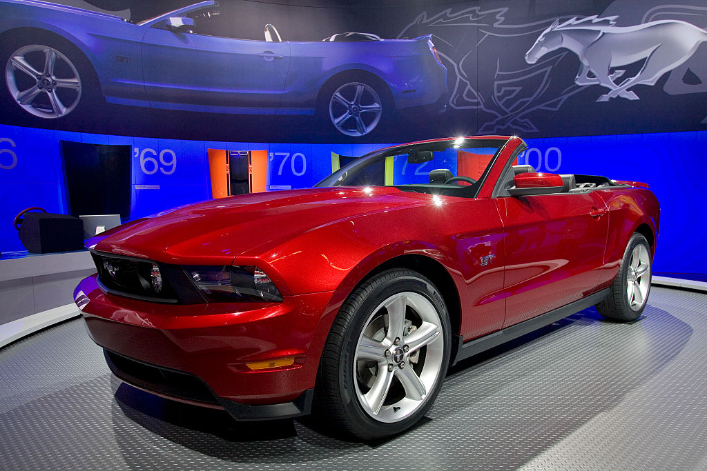 A red 2009 Ford Mustang GT on display.