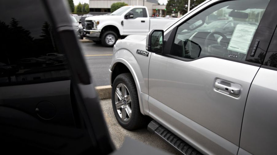 2019 Ford F-150 pickup trucks are displayed at a car dealership in Orland Park, Illinois