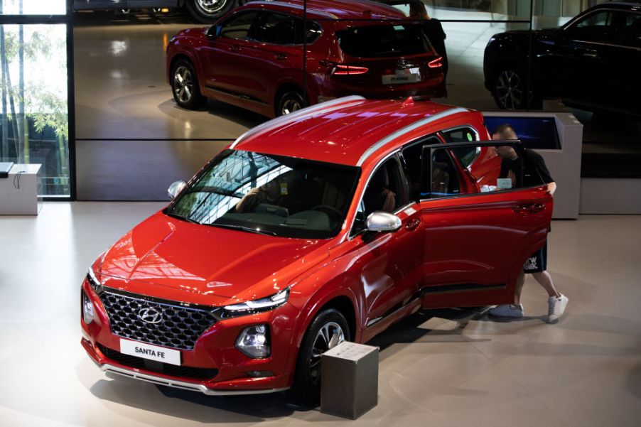 A customer looks at a Hyundai Santa Fe SUV