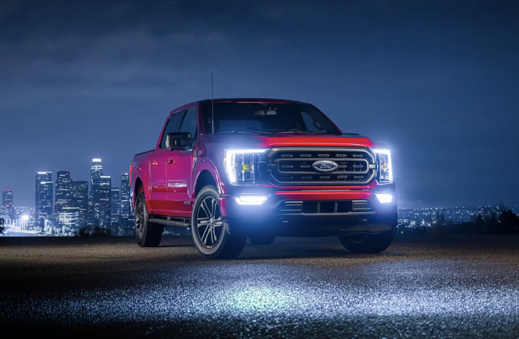 The Ford f-150 parked near a city at night