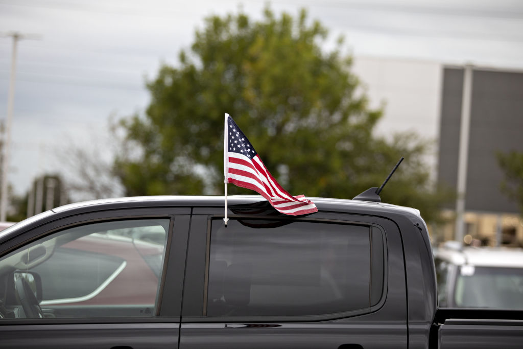 An American flag flies from the window of a 2019 Ford Ranger pickup truck