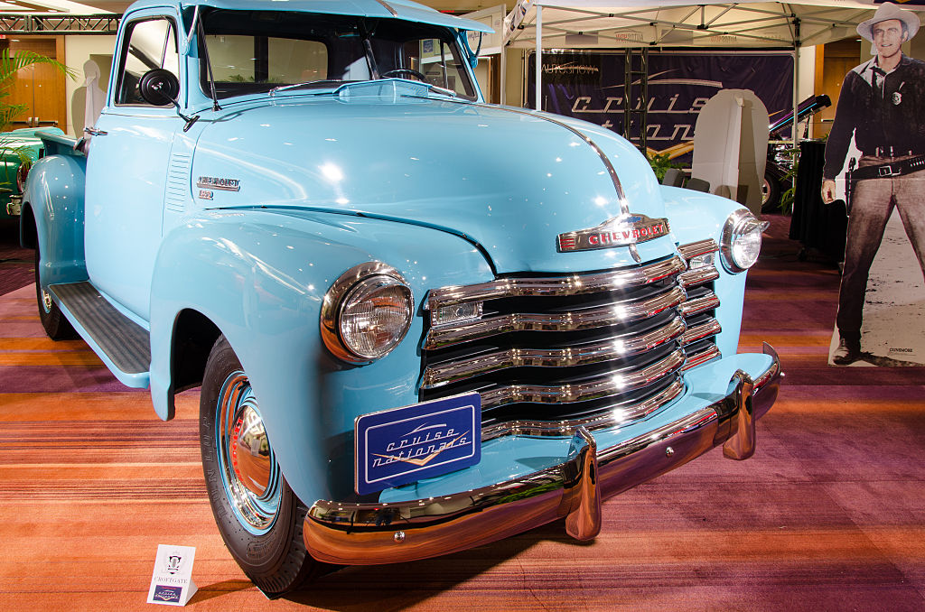 A light blue restored classic Chevy pickup truck on display.