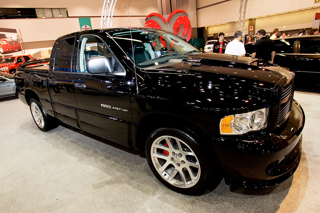 A black Dodge Ram SRT-10 in a garage.