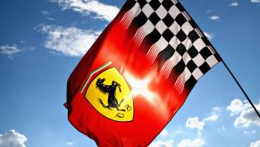 Ferrari logo on a flag flying in the wind.